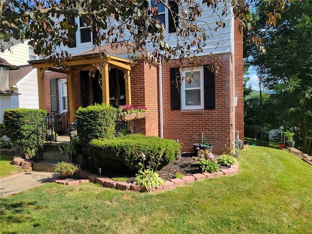 53 Orchard Pl, Bradford City, PA 16701 - view of front of property with brick siding and a front lawn