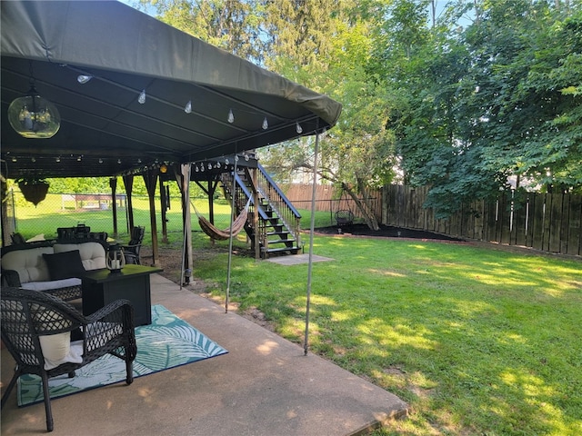 53 Orchard Pl, Bradford City, PA 16701 - fenced backyard with stairs, a patio, and an outdoor living space