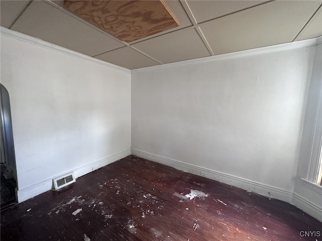 unfurnished room with wood-type flooring and a paneled ceiling