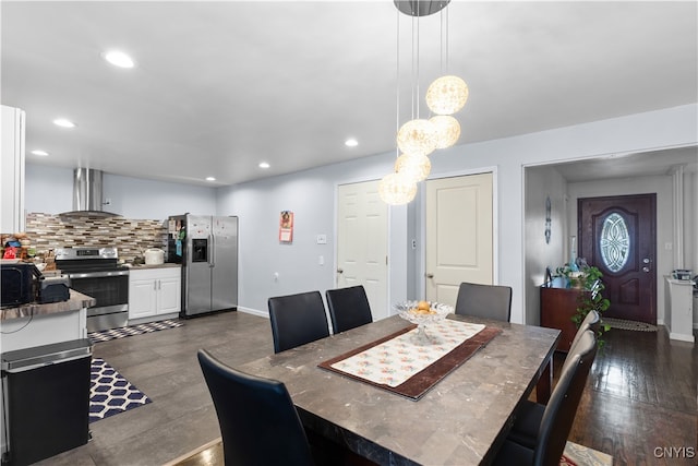 dining area with dark hardwood / wood-style flooring