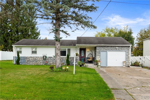 ranch-style house featuring a front yard and a garage