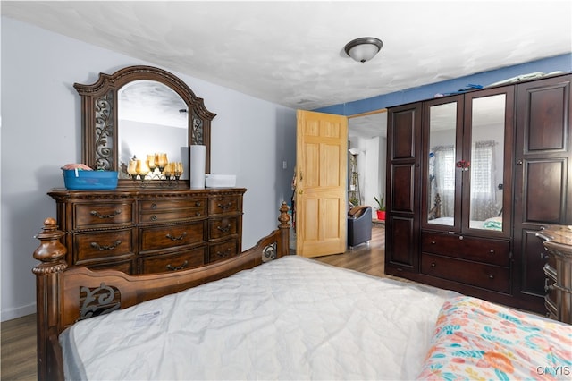 bedroom featuring hardwood / wood-style floors