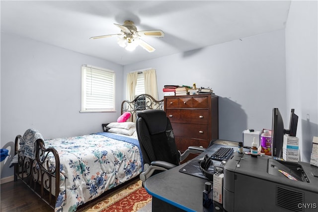 bedroom featuring ceiling fan and dark hardwood / wood-style floors