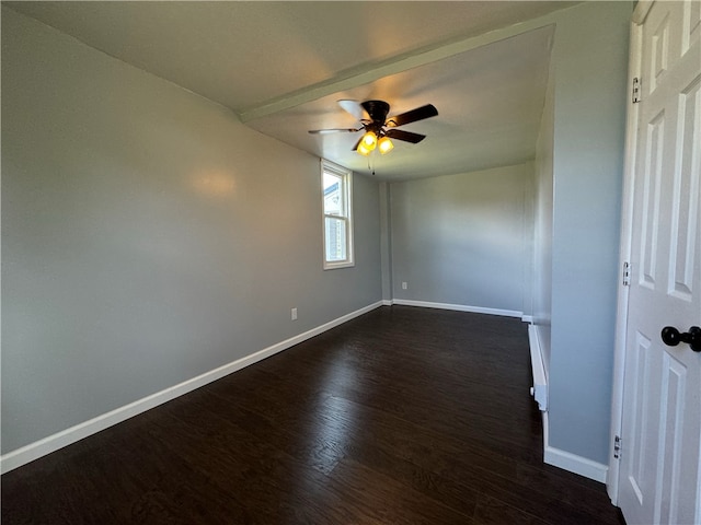 spare room with ceiling fan and dark hardwood / wood-style floors