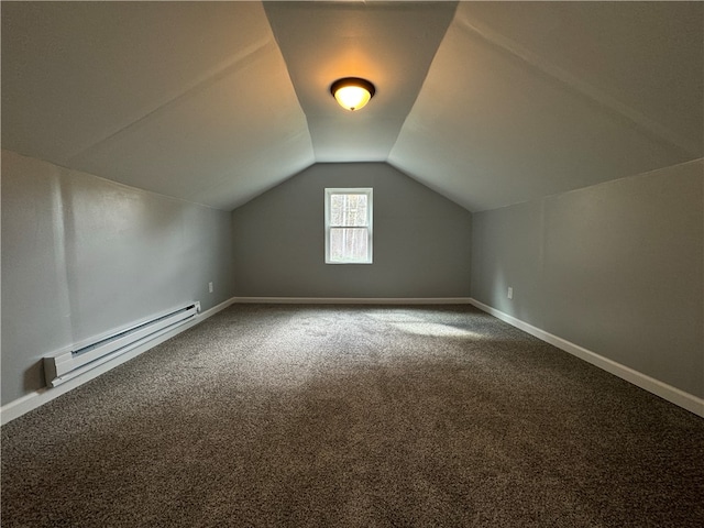 additional living space featuring carpet, a baseboard heating unit, and lofted ceiling