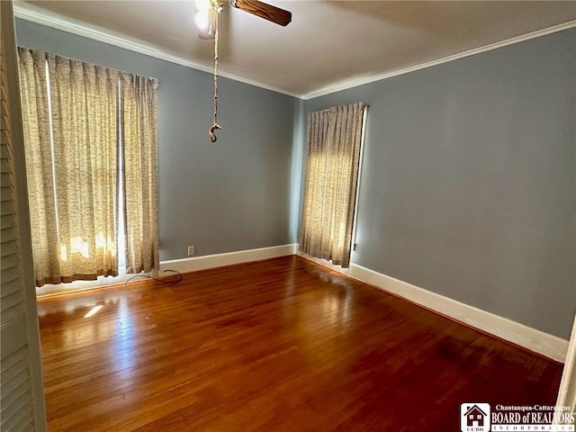 unfurnished room featuring crown molding, wood-type flooring, and ceiling fan