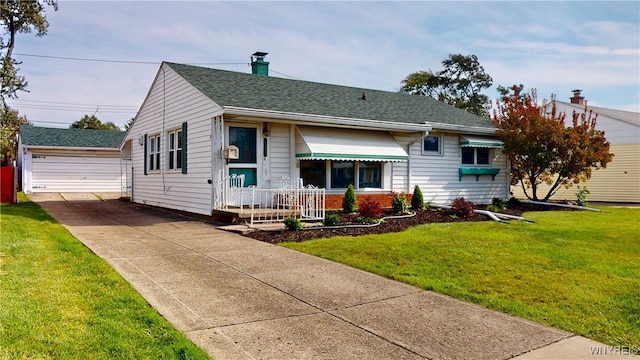 view of front of home with a garage, an outdoor structure, and a front lawn