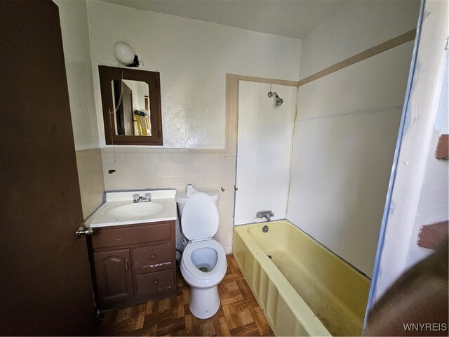 full bathroom with shower / bath combination, parquet flooring, toilet, tile walls, and vanity