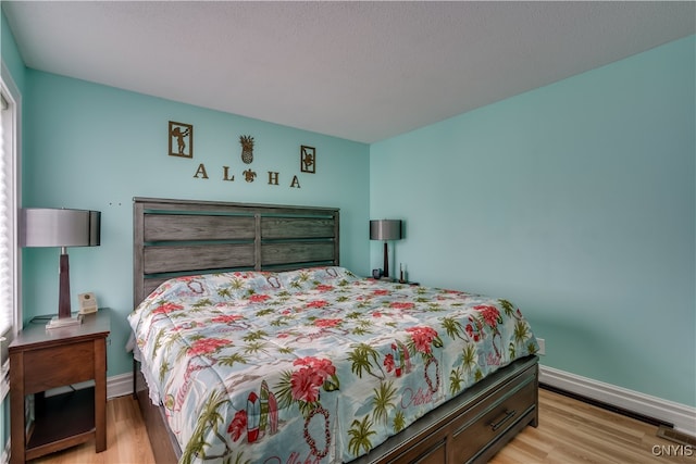 bedroom featuring light wood-type flooring