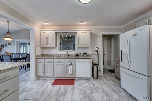 kitchen with pendant lighting, white appliances, sink, light stone counters, and white cabinetry