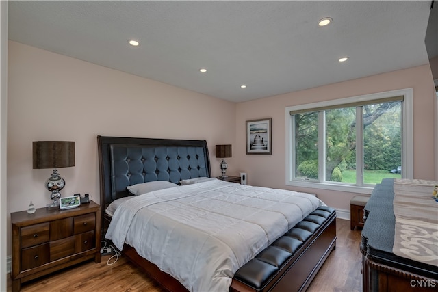 bedroom with wood-type flooring