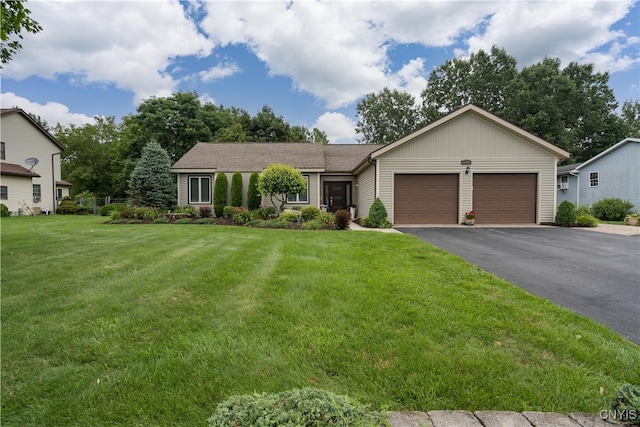 single story home featuring a front yard and a garage