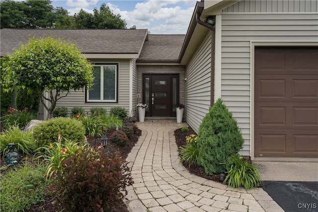 doorway to property featuring a garage