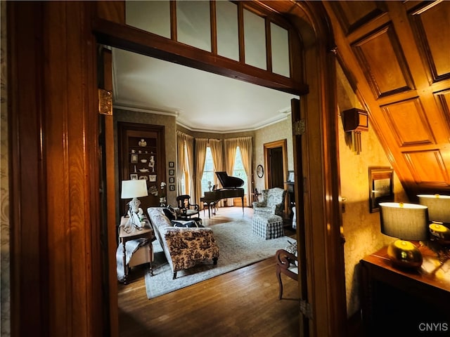 interior space featuring wood-type flooring, crown molding, and coffered ceiling