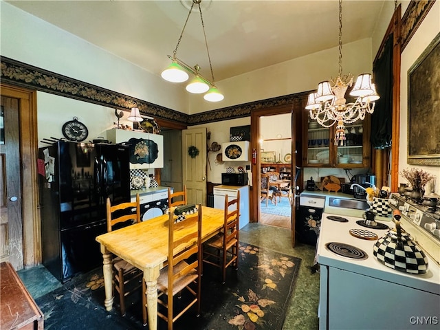 dining space with a notable chandelier and sink