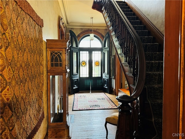 entryway with crown molding