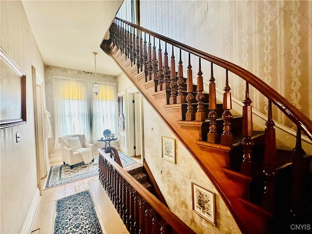 staircase with tile patterned floors