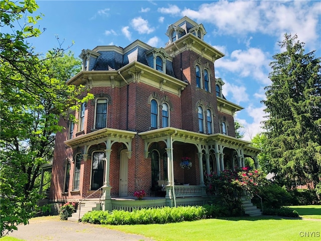 italianate-style house with a front lawn and a porch