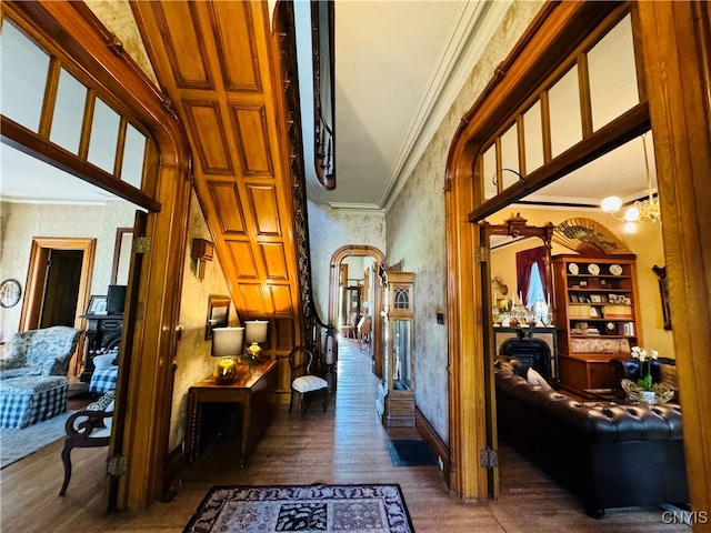 hallway with crown molding and dark hardwood / wood-style flooring