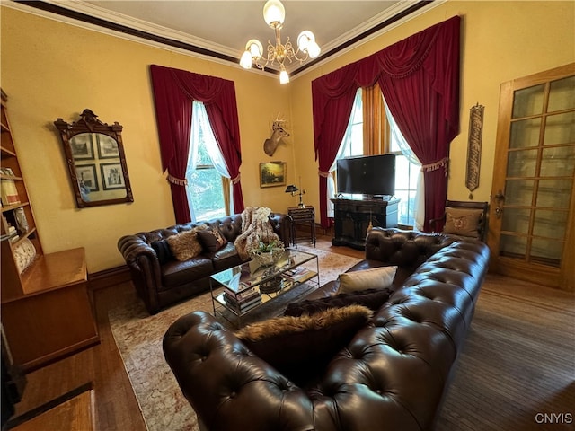 living room with ornamental molding, hardwood / wood-style floors, and an inviting chandelier