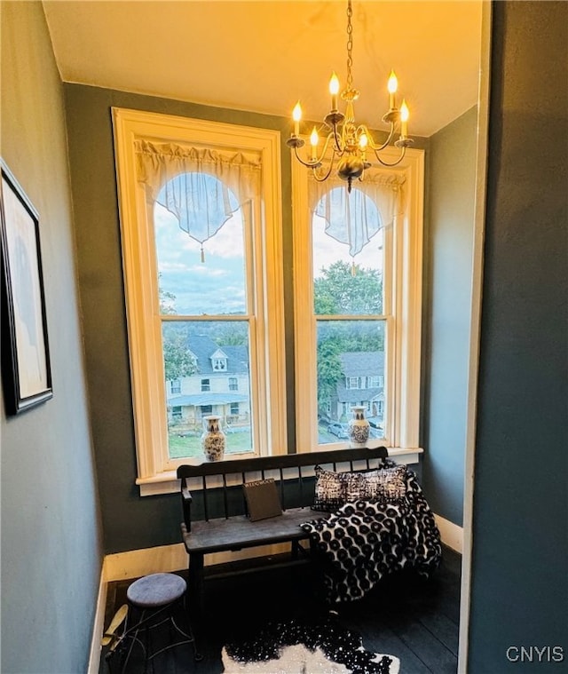 miscellaneous room featuring an inviting chandelier