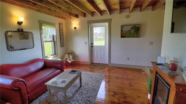 living room with wood ceiling, beam ceiling, and light wood-type flooring