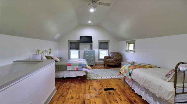 bedroom with wood-type flooring, lofted ceiling, and ceiling fan