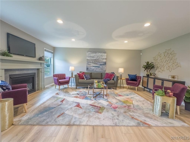 299 Cardinal Way N, Tonawanda, NY 14120 - living area with wood finished floors, a glass covered fireplace, and recessed lighting