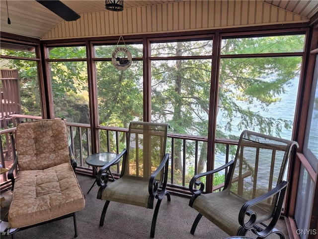 sunroom / solarium with wood ceiling, vaulted ceiling, a water view, and a wealth of natural light