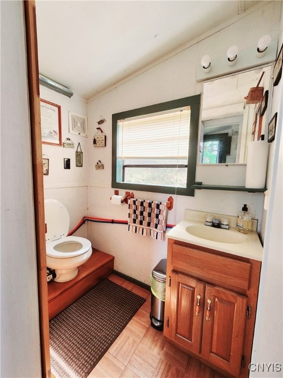 bathroom with vanity and toilet