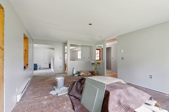 living room with a baseboard heating unit