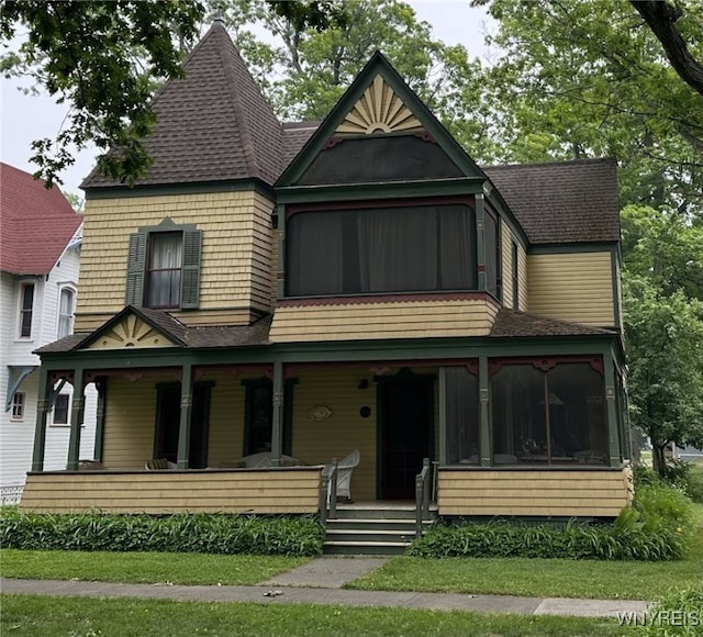 victorian-style house featuring a porch