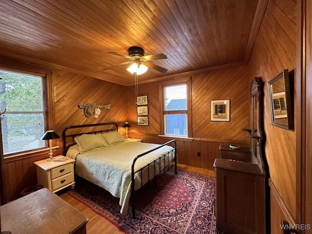 42916 St Lawrence Ave, Orleans, NY 13692 - bedroom featuring wooden ceiling, wood finished floors, wooden walls, and a ceiling fan