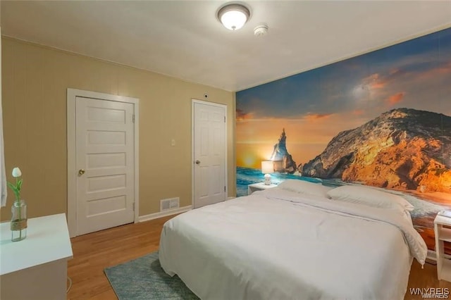 bedroom featuring hardwood / wood-style flooring