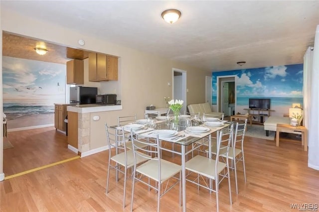 dining space featuring light hardwood / wood-style flooring