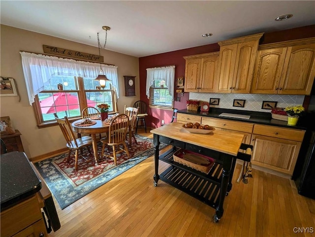 644 Main St, Independence, NY 14897 - kitchen with light wood-style floors, dark countertops, decorative backsplash, decorative light fixtures, and recessed lighting