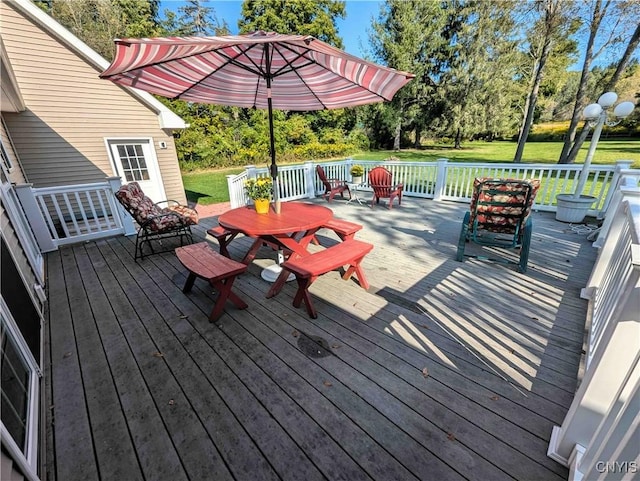 644 Main St, Independence, NY 14897 - wooden terrace featuring outdoor dining area, a yard, and view of wooded area