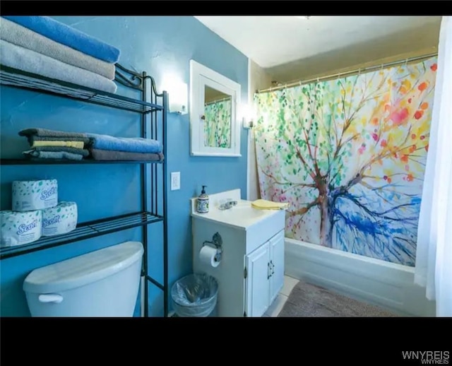 full bathroom featuring shower / bath combination with curtain, vanity, and toilet