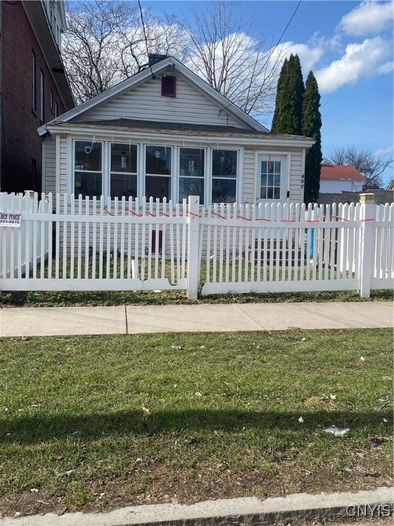 bungalow with a front lawn