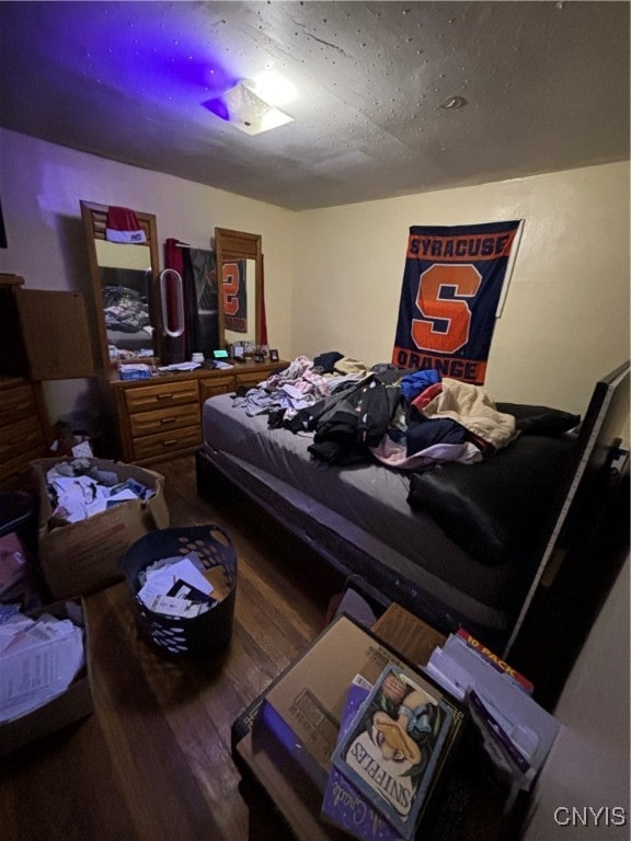 bedroom featuring wood-type flooring