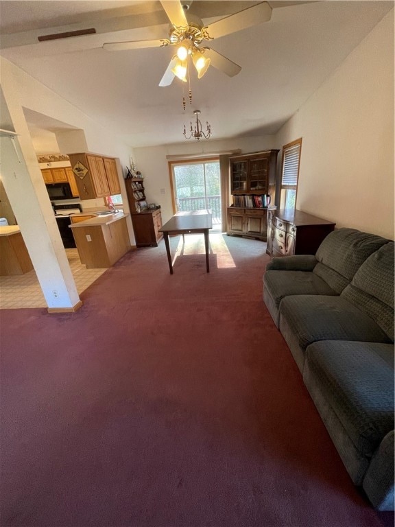 living room with ceiling fan and carpet floors