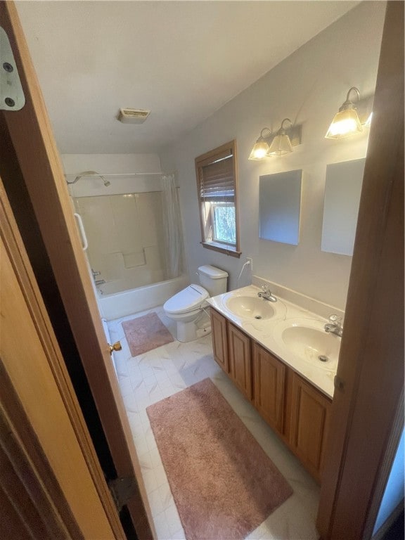 full bathroom featuring vanity, shower / bath combination with curtain, toilet, and tile patterned floors