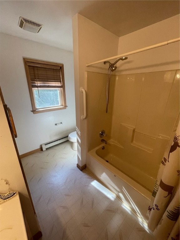 bathroom featuring toilet, baseboard heating, and shower / tub combo