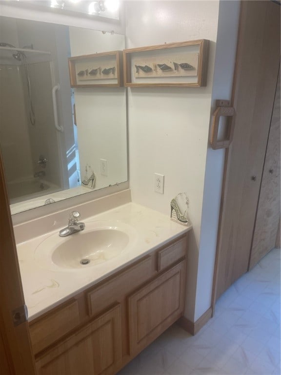 bathroom featuring vanity and bathing tub / shower combination