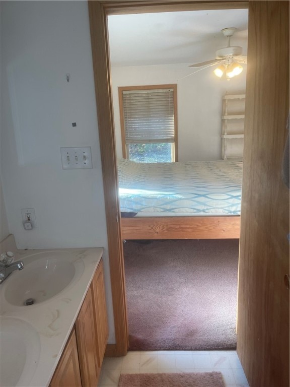 bathroom featuring vanity, ceiling fan, and tile patterned floors