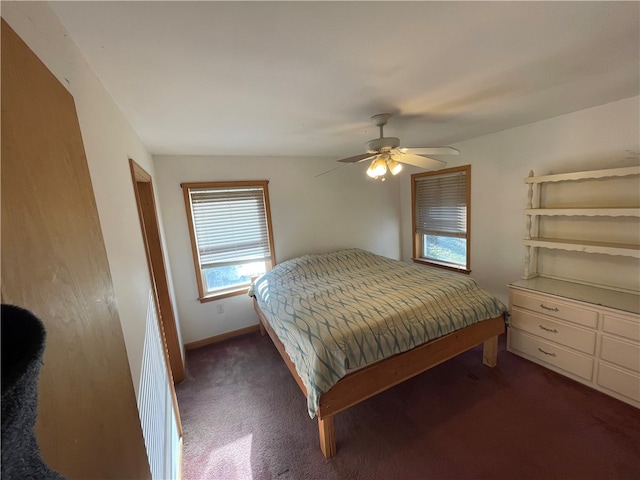 carpeted bedroom featuring vaulted ceiling and ceiling fan