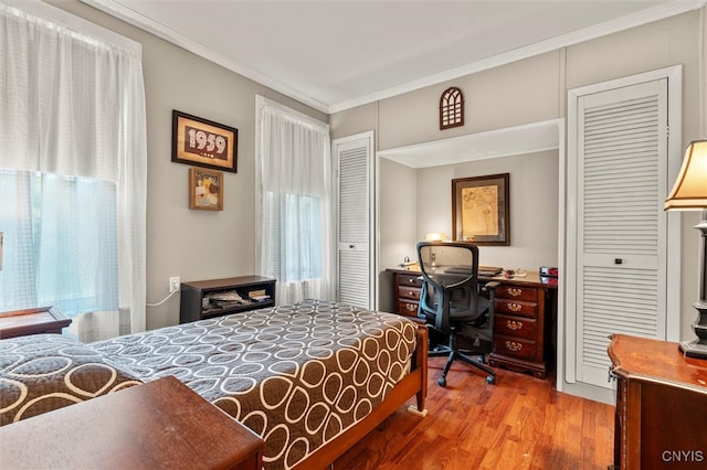 bedroom featuring crown molding and hardwood / wood-style floors