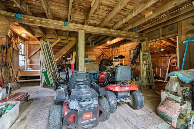 miscellaneous room featuring wood walls and hardwood / wood-style floors