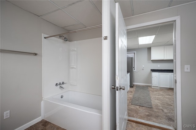 bathroom featuring vanity, shower / washtub combination, and a paneled ceiling