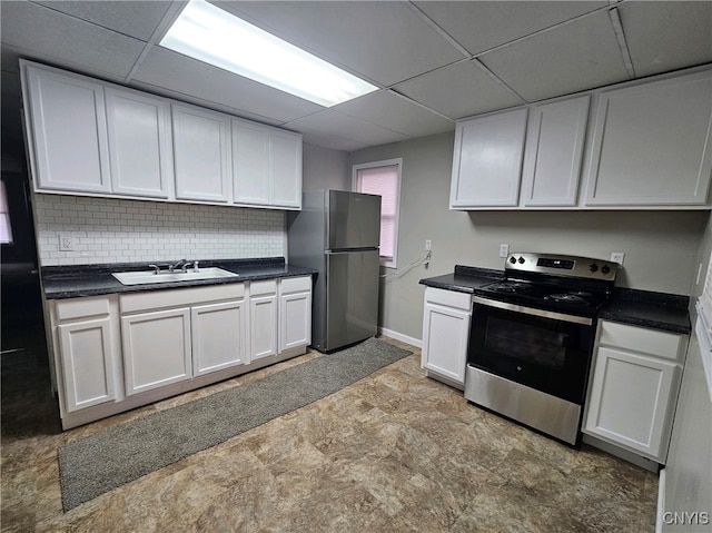 kitchen with appliances with stainless steel finishes, sink, and white cabinets